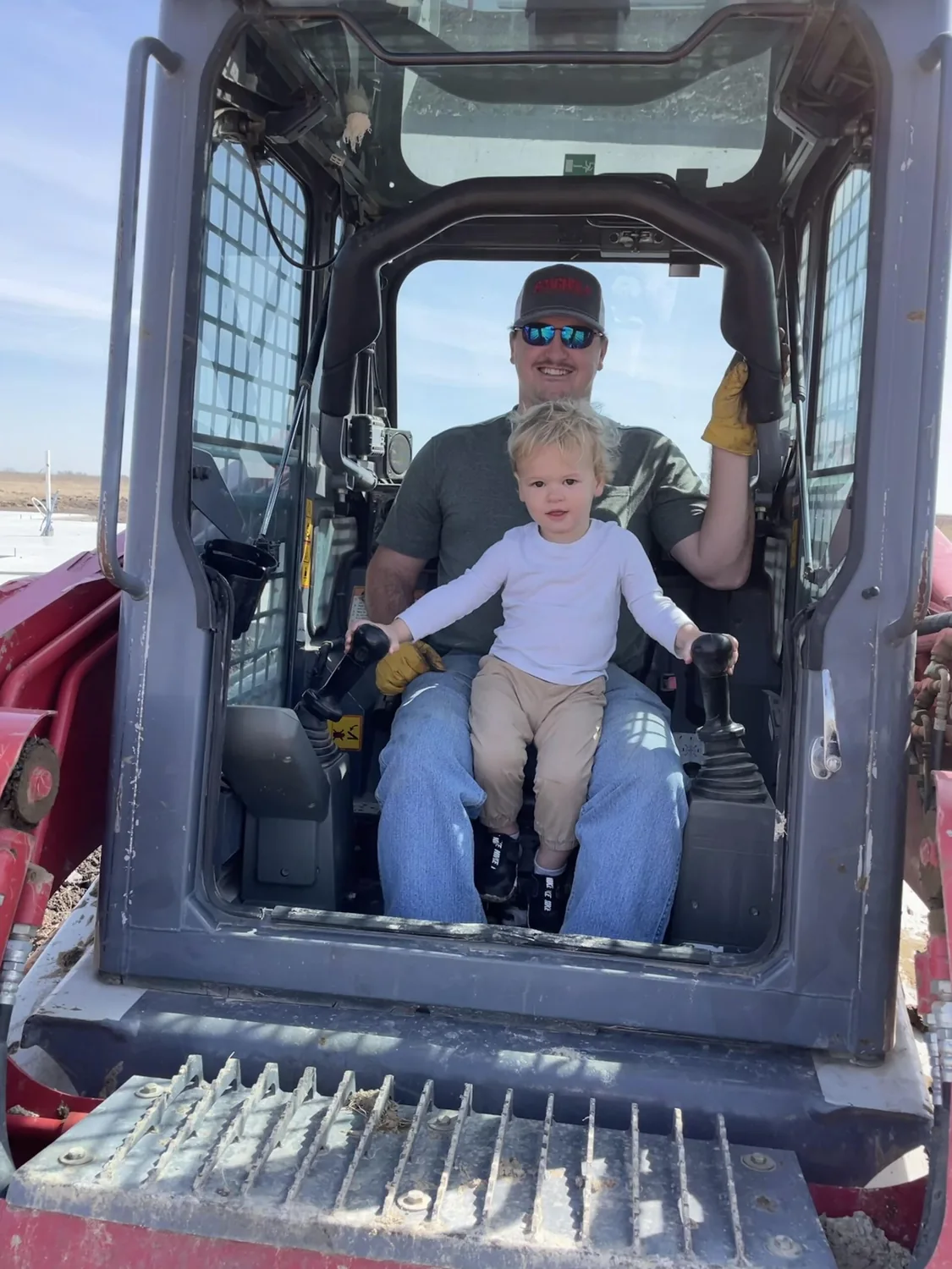 Austin Spagnola at the controls of a tracked loader